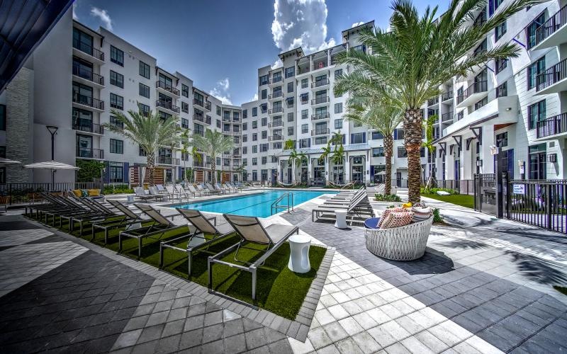 swimming pool surrounded by lounge chairs