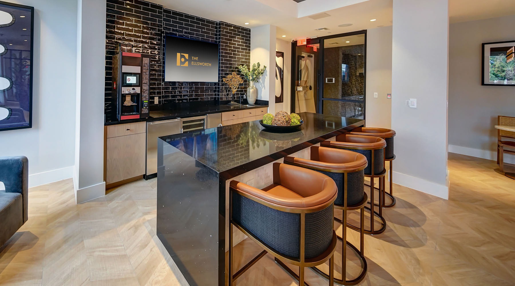 clubhouse kitchen with an island and stools